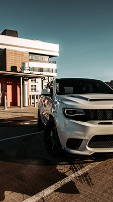 White SUV car in parking lot